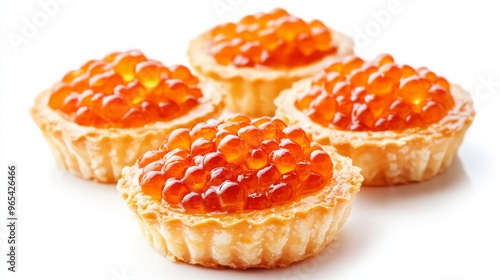 Tartlets with red caviar isolated on white background. photo