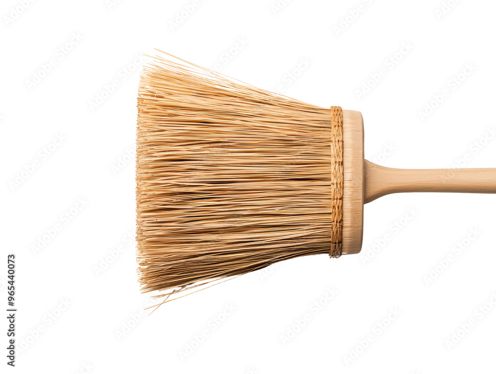 Close-Up of a Traditional Straw Broom Isolated on Background for Cleaning and Household Chores Close-Up of a Traditional Straw Broom Isolated on Background for Cleaning and Household Chores