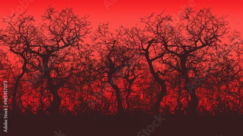 A striking image featuring the silhouette of trees against a dramatic red sky, creating a stark and intense visual scene with an abstract and dramatic appeal. photo