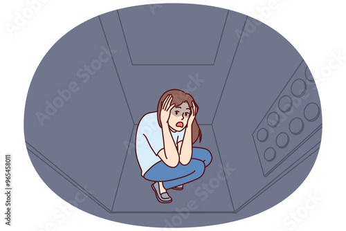 Woman stuck in elevator is claustrophobia and panic attack due to phobia of enclosed spaces. Young girl rides in moving elevator in need of psychological help to treat claustrophobia