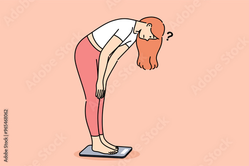 Sad woman checking own weight by stepping on scales and feeling embarrassed by increasing kilograms. Psychological disorder in thin girl who wants to become thinner and lose weight