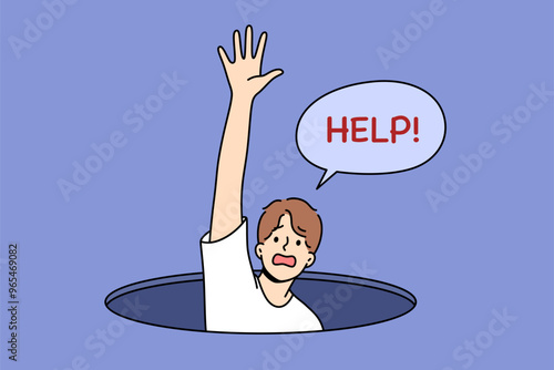 Man fallen into hole screams for help and raises hand, for concept of panic attack and helplessness. Panic attack in guy at risk of going crazy due to severe depression and mental disorder