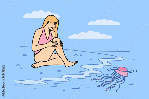 Jellyfish left burn on woman body after coming into contact with underwater in tropical ocean. Wound from jellyfish causes irritation and redness on skin of girl in need of medicinal ointment