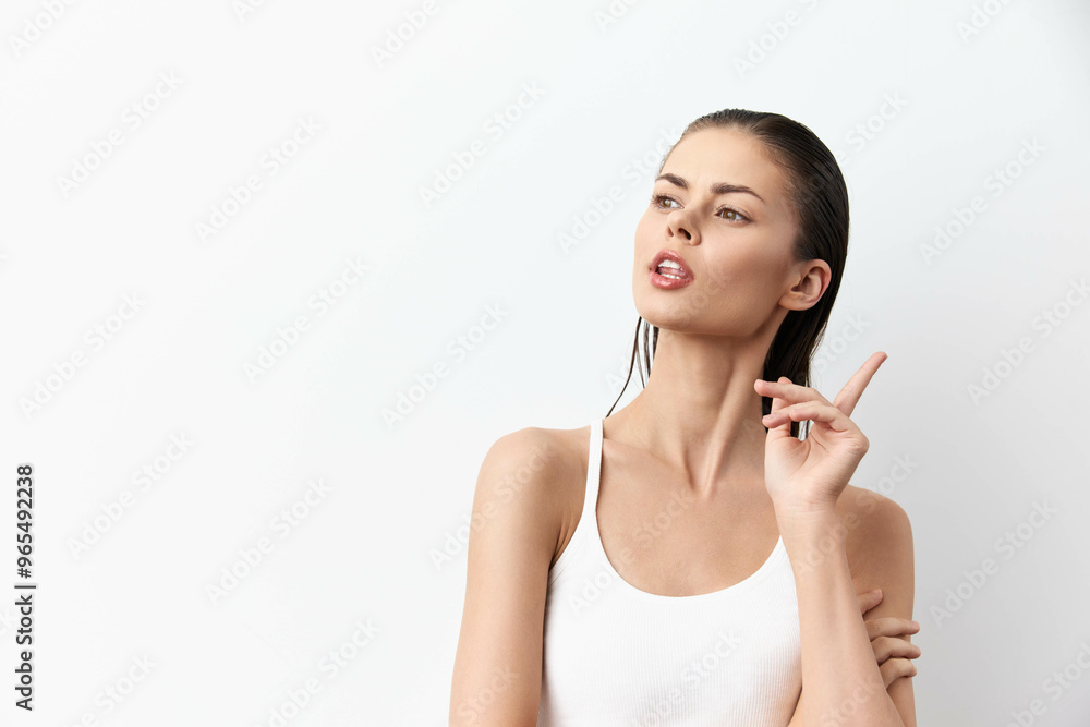 portrait of a thoughtful young woman with long hair, wearing a sleeveless white top against a minimalistic white background, expressing curiosity and contemplation with a graceful pose and gestures portrait of a thoughtful young woman with long hair, wearing a sleeveless white top against a minimalistic white background, expressing curiosity and contemplation with a graceful pose and gestures