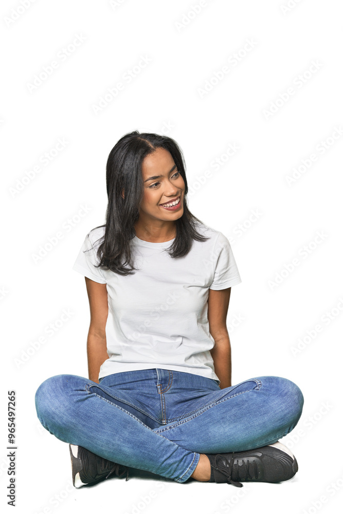 Elegant Latina sitting and posing in studio Elegant Latina sitting and posing in studio