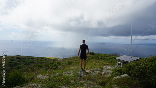 Hike before the rain in a tropical island rain in the distance fitness active life