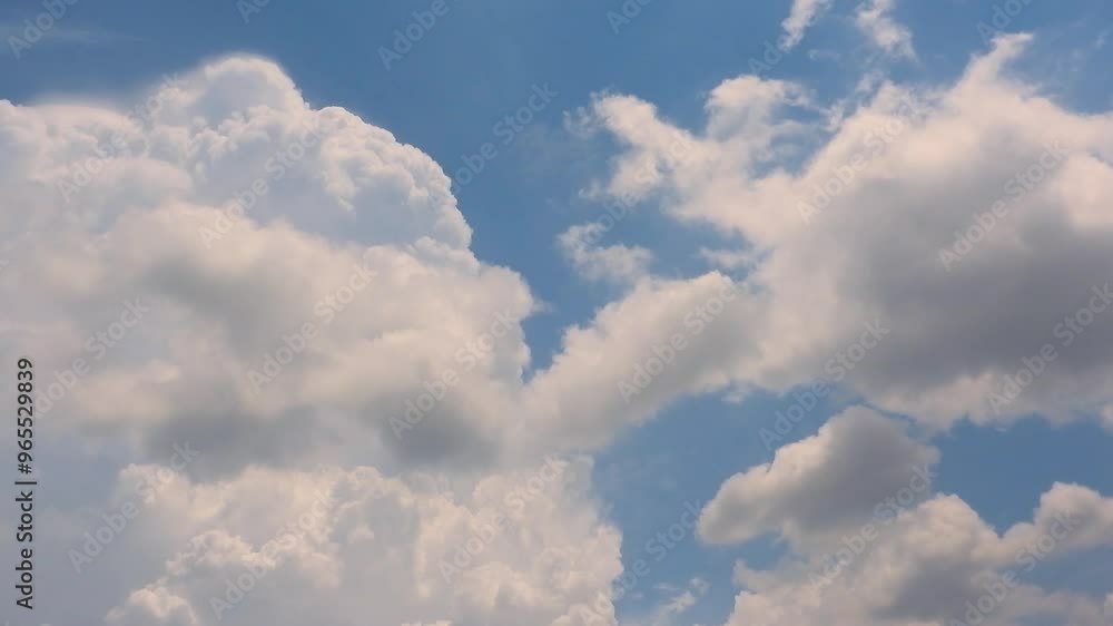 Timelapse of white clouds drifting across a clear blue sky Timelapse of white clouds drifting across a clear blue sky
