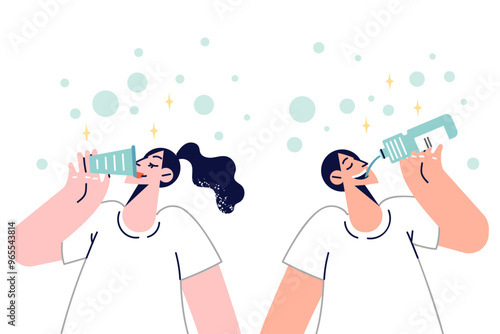 Man and woman drink fresh water from mineral spring to refresh themselves on hot summer day