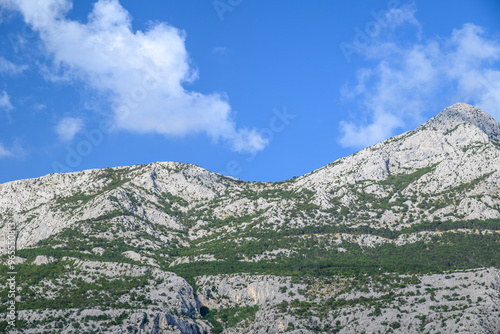 View of the Biokovo mountain range of the Dinaric Alps from Makarska riviera, Adriatic coast of Croatia photo