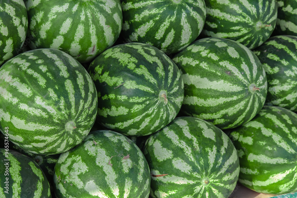 Many watermelons are taken with filling of the frame composition at the market. Watermelon is a very popular sweet fruit. Many watermelons are taken with filling of the frame composition at the market. Watermelon is a very popular sweet fruit.