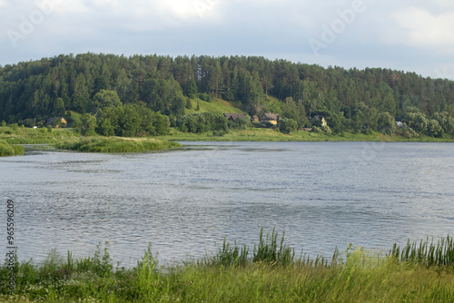 Beautiful river landscape on a summer day. The bend of the Nemunas (Neman) River near the town of Merkinė, southern Lithuania. photo