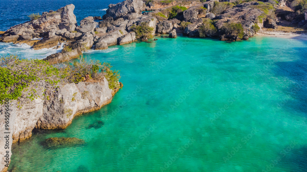 A mesmerizing view of a turquoise lagoon, where high cliffs provide a dramatic backdrop to this tranquil paradise A mesmerizing view of a turquoise lagoon, where high cliffs provide a dramatic backdrop to this tranquil paradise