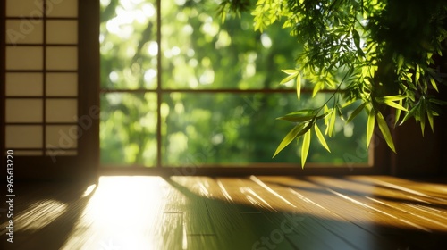 Serene Japanese-inspired room with sunlight streaming through windows, casting shadows on wooden flooring and highlighting green foliage. photo