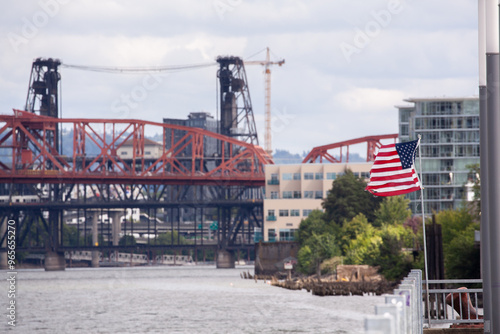 Broadway and Steel bridges and American USA flag in Portland Oregon over Willamette River photo