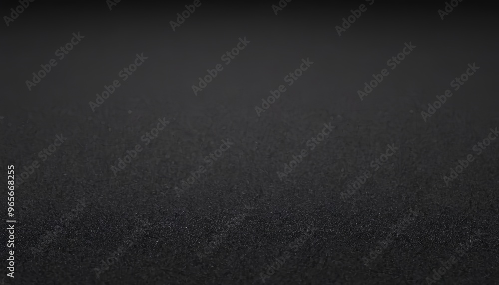 Close up of textured black surface with a slight gradient.