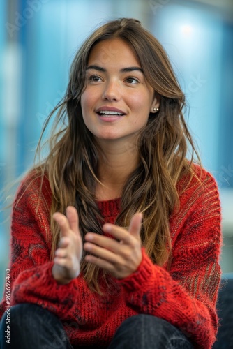 Wallpaper Mural Radiant Young Woman in Red Sweater Engaging in Conversation Torontodigital.ca
