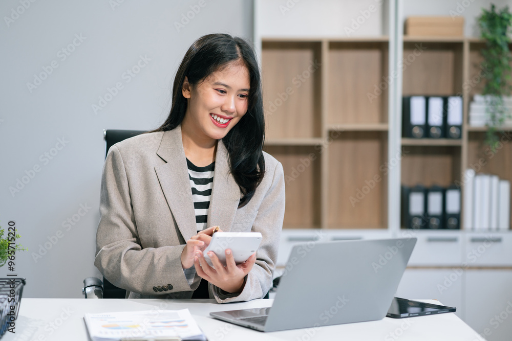 Businesswomen working with smart phone and laptop and digital tablet computer in office with digital marketing media in virtual icon. Businesswomen working with smart phone and laptop and digital tablet computer in office with digital marketing media in virtual icon.