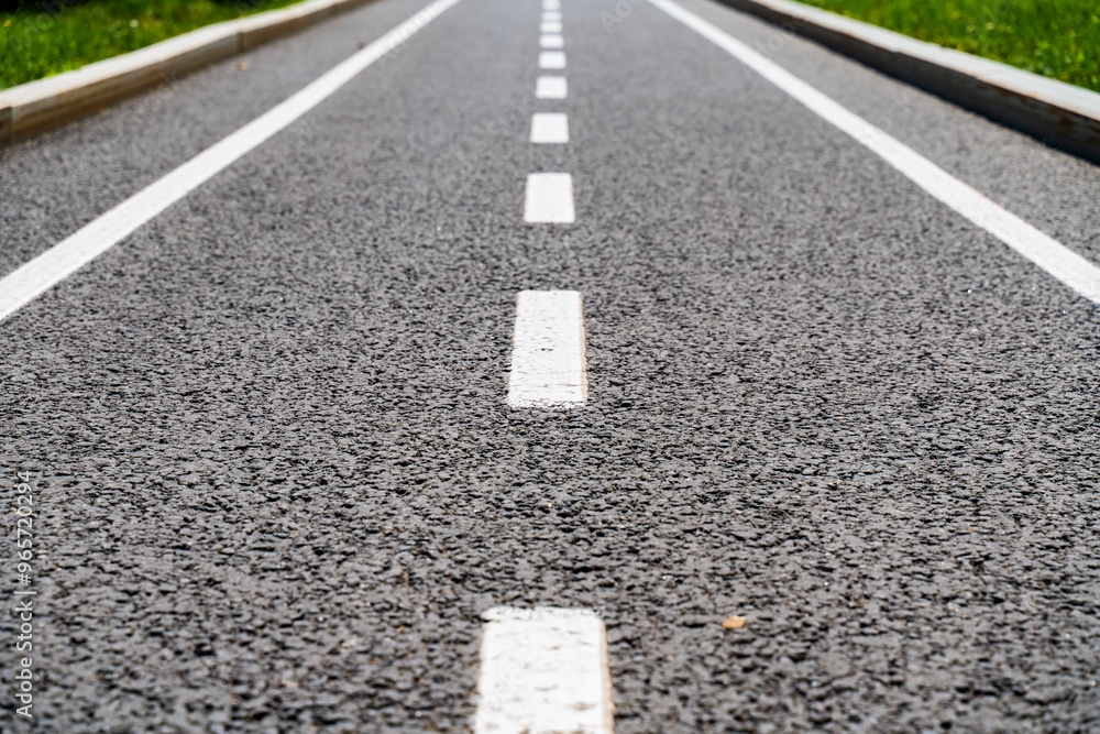 white lines on the asphalt close-up, road markings breaking line white lines on the asphalt close-up, road markings breaking line