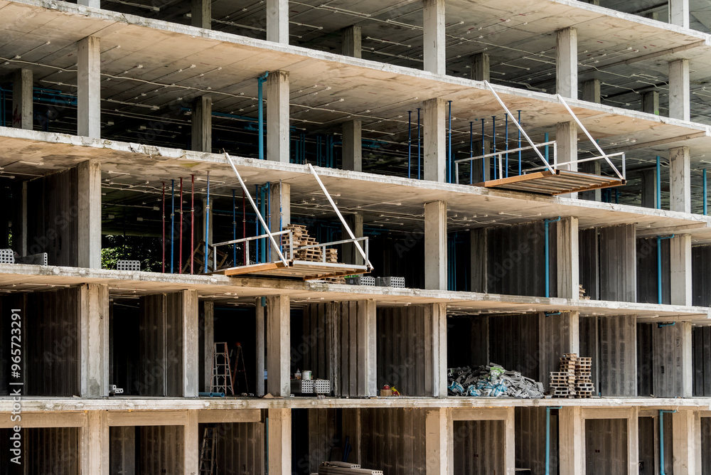 A new modern multi-storey residential building under construction A new modern multi-storey residential building under construction