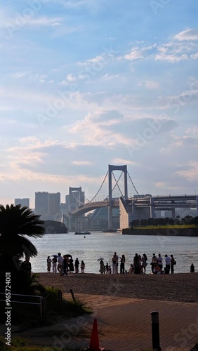 Rainbow bridge in Odaiba in Tokyo view from beach 