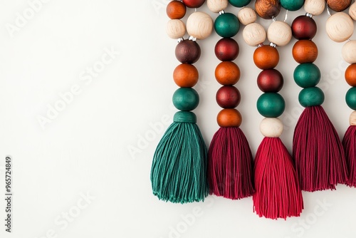 Colorful wooden beads and tassels arranged elegantly on a neutral background, perfect for craft and decoration themes. photo