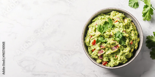 Guacamole in a wide, shallow dish, smooth surface