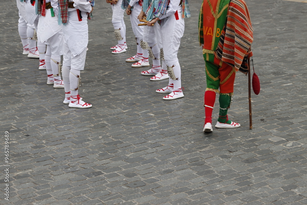 Basque folk dancers during a performance in an outdoor festival Basque folk dancers during a performance in an outdoor festival