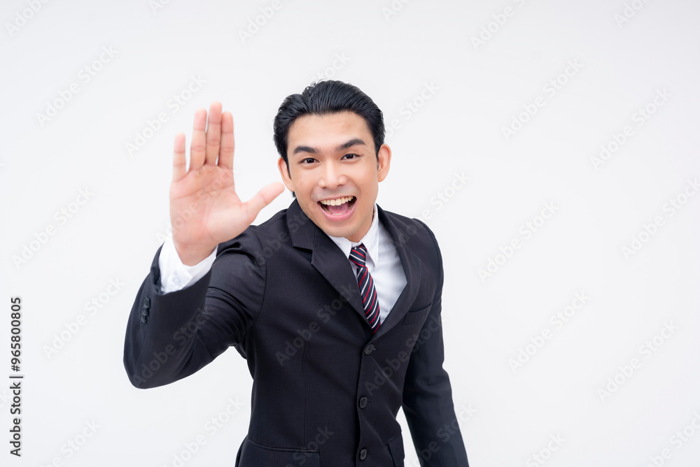 An enthusiastic young asian businessman giving a hi-five. A man in a suit and tie beaming with optimism, isolated on a white background. An enthusiastic young asian businessman giving a hi-five. A man in a suit and tie beaming with optimism, isolated on a white background.