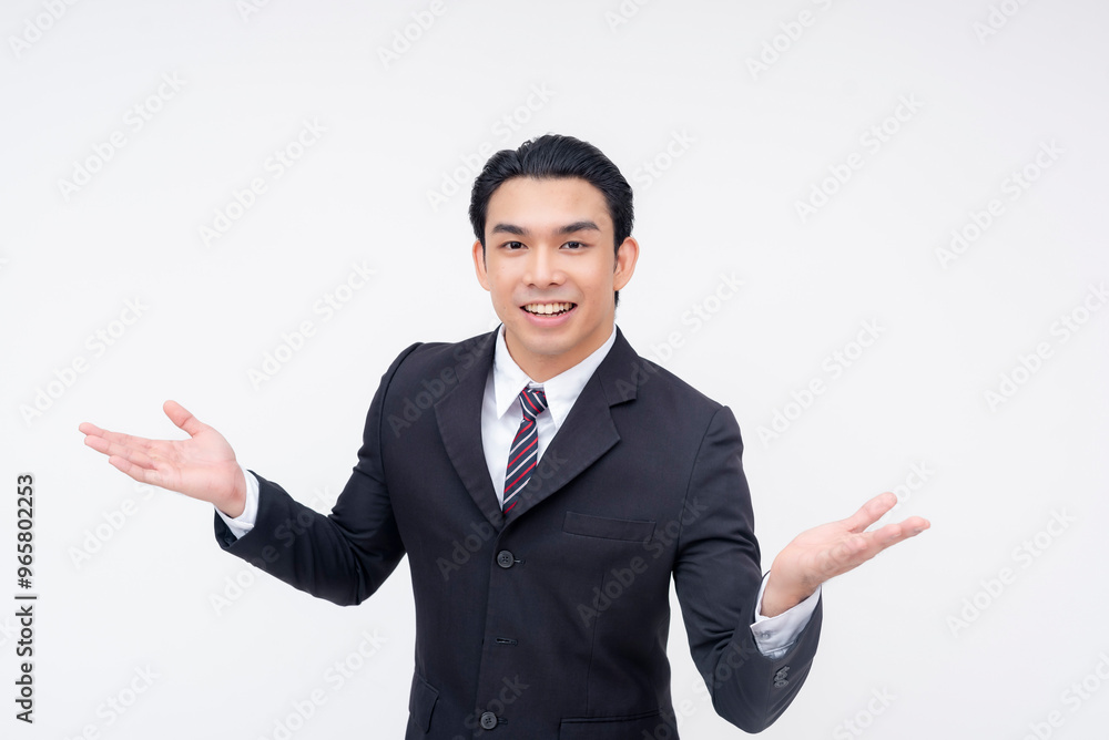 An optimistic and ambitious young asian business executive in a fashionable suit and tie eagerly explaining his proposal. Isolated on a white background. An optimistic and ambitious young asian business executive in a fashionable suit and tie eagerly explaining his proposal. Isolated on a white background.