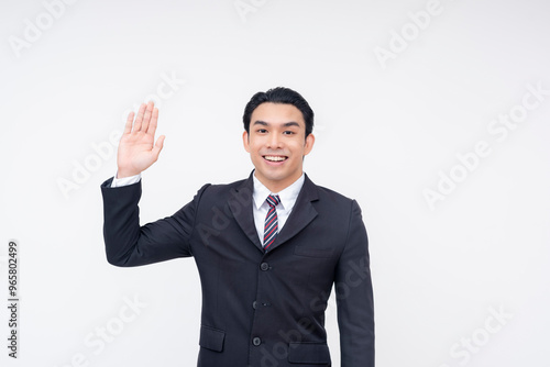 Принти на полотні A young asian business executive swearing an oath, promising to be truthful