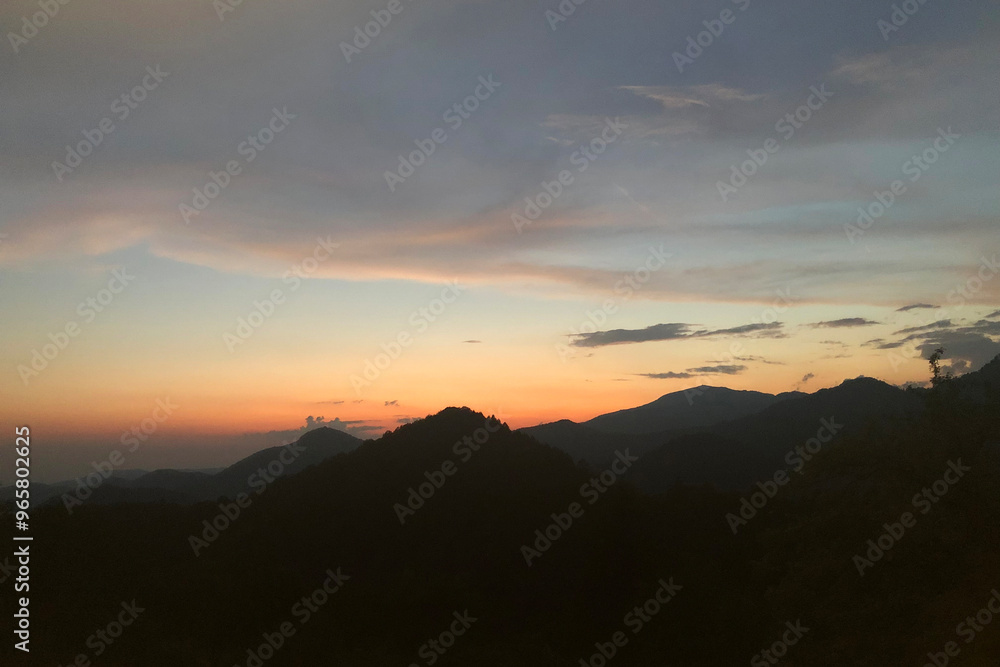 Colorful Sunset Sky on the Julian Alps during a Summer Day. Valli del Natisone, Italy-Slovenia Border. Clabuzzaro, Udine Province, Friuli Venezia Giulia, Italy Colorful Sunset Sky on the Julian Alps during a Summer Day. Valli del Natisone, Italy-Slovenia Border. Clabuzzaro, Udine Province, Friuli Venezia Giulia, Italy