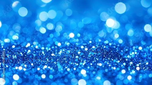 Sparkling Blue Vintage Lights, a mesmerizing backdrop of shimmering blue glitter, softly blurred to create an enchanting atmosphere perfect for celebrations and creativity.