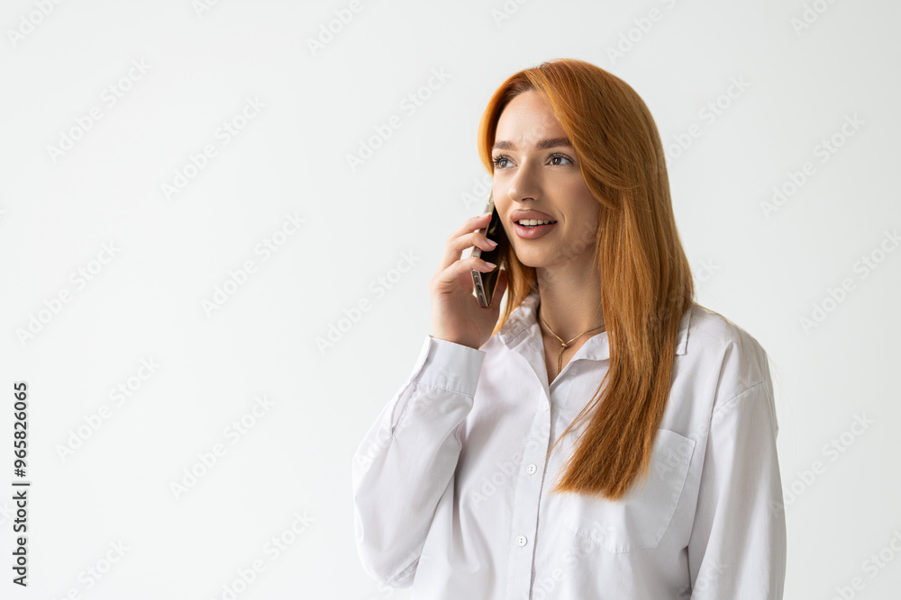 Portrait of a smiling young business woman talking on mobile phone over white background Portrait of a smiling young business woman talking on mobile phone over white background