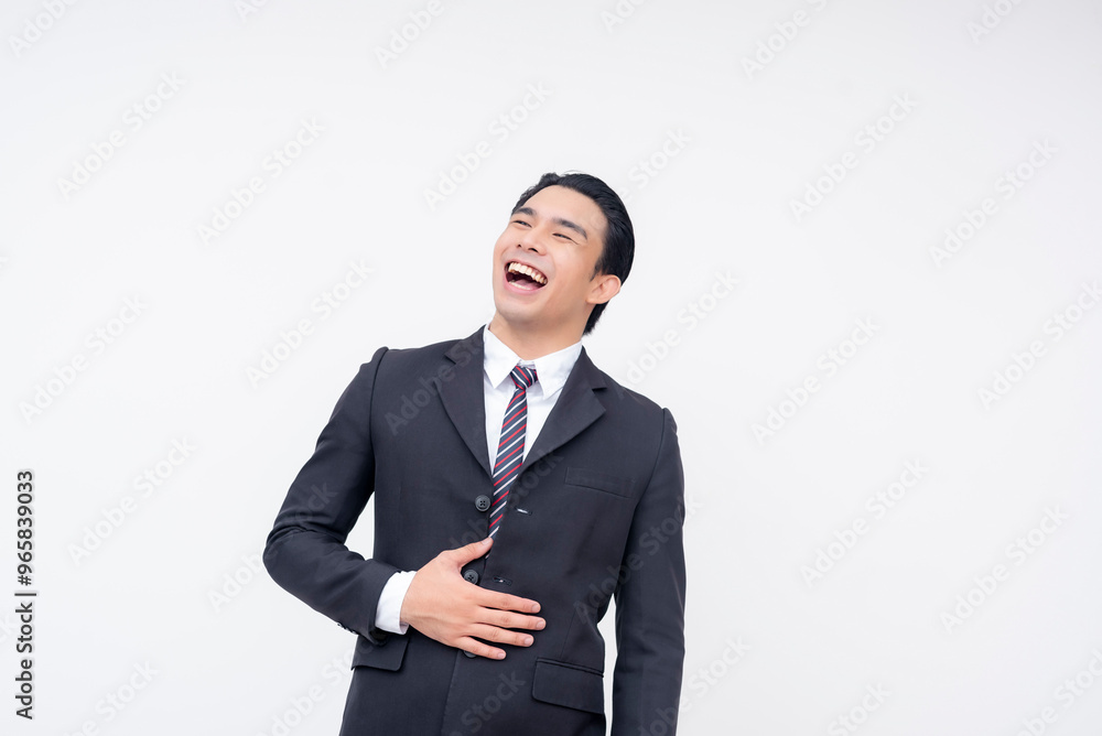 A young cheerful asian business executive in a suit and tie having a hearty laugh. Isolated on a white background. A young cheerful asian business executive in a suit and tie having a hearty laugh. Isolated on a white background.