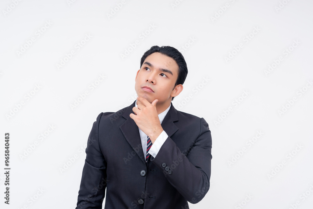 A young and introspective asian business executive pondering some decisions to make. Isolated on a white background. A young and introspective asian business executive pondering some decisions to make. Isolated on a white background.