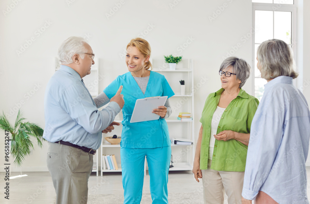 Fototapeta premium Doctor or nurse holding a meeting with a group of senior patients at a nursing home. The healthcare professional is talking and providing care, creating a happy and supportive environment.