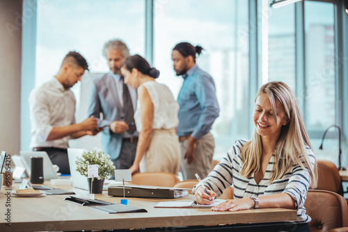 Diverse Team Collaborating in Modern Office Environment