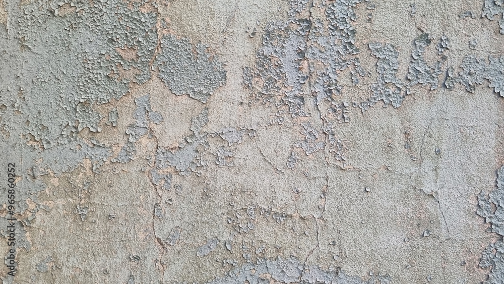 Peeling paint on an old wall. Grunge background for design.Selective focus Peeling paint on an old wall. Grunge background for design.Selective focus