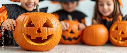 A group of children in Halloween costumes carving pumpkins together, playful competition in the air pumpkin carving party, kids Halloween, joyful atmosphere