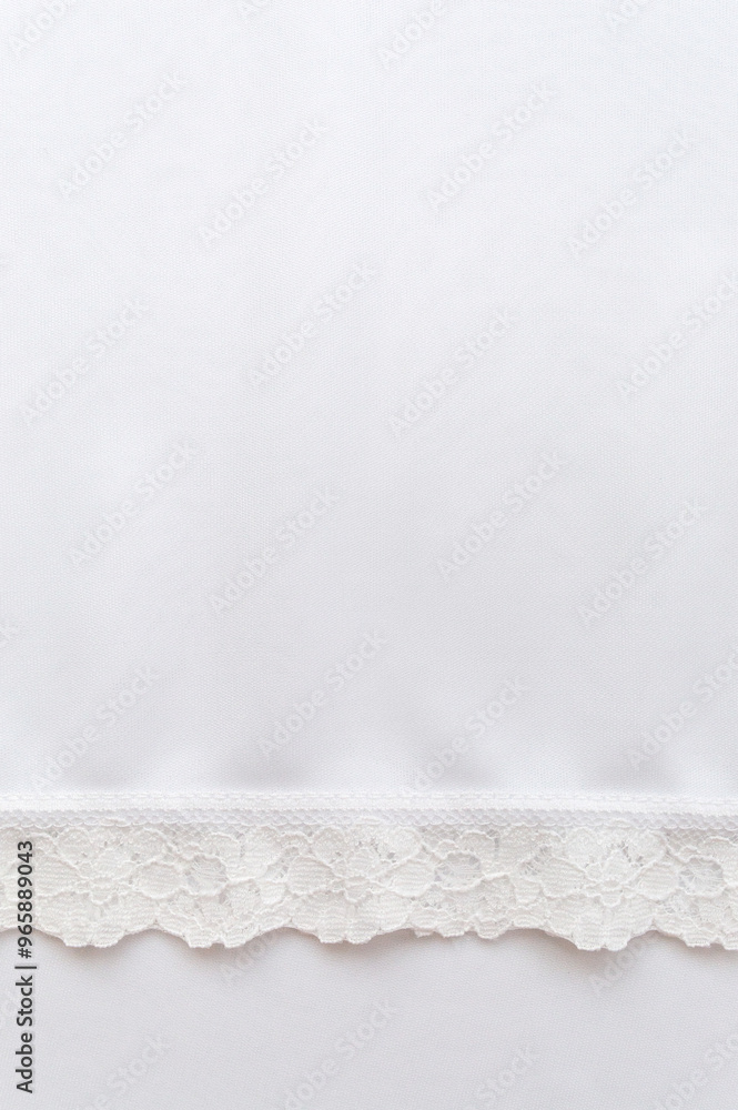 Obraz premium White fabric with a lace border.