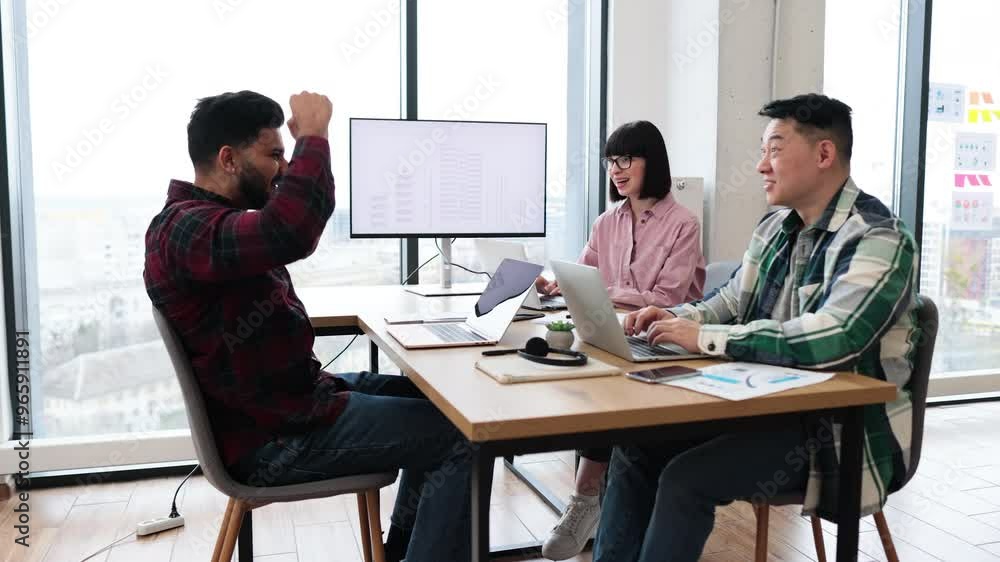 Real estate agents collaborating in modern office with city view. Teamwork, cooperation, business planning, and communication among coworkers. Real estate agents collaborating in modern office with city view. Teamwork, cooperation, business planning, and communication among coworkers.