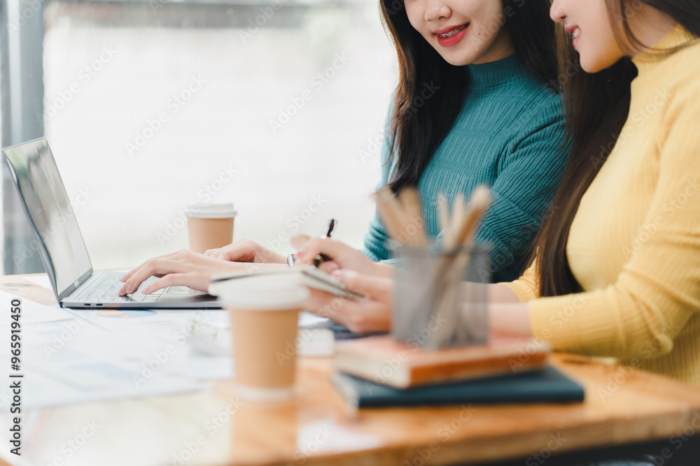 Collaborative work between two women at modern workspace, sharing ideas. Collaborative work between two women at modern workspace, sharing ideas.
