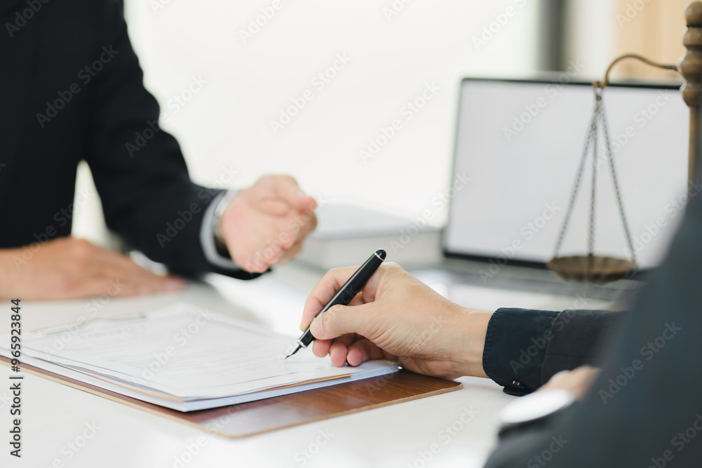 Legal consultation with documents and scale of justice present. Legal consultation with documents and scale of justice present.