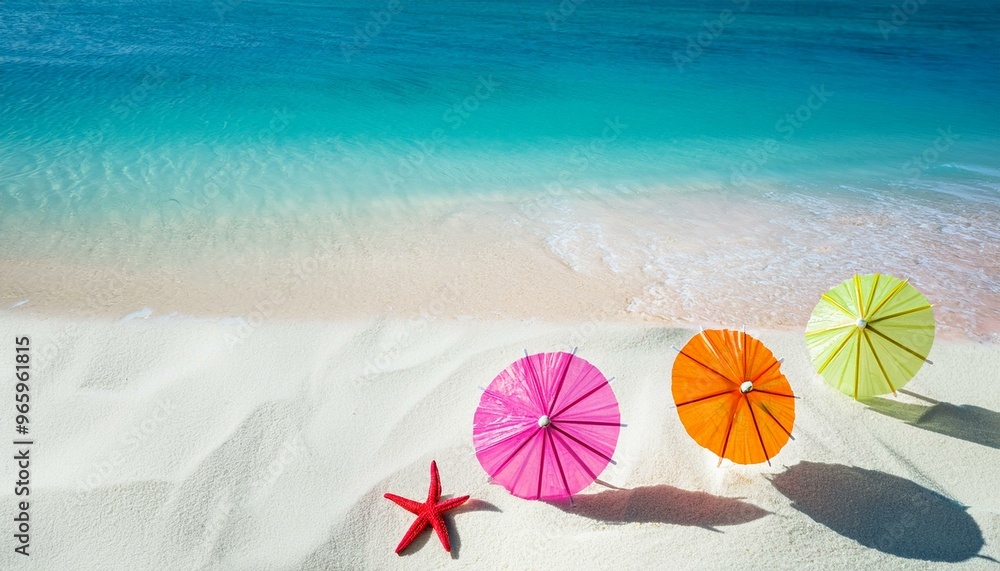 Colorful beach umbrellas on white sand with turquoise water and starfish. Summer vacation concept. Colorful beach umbrellas on white sand with turquoise water and starfish. Summer vacation concept.