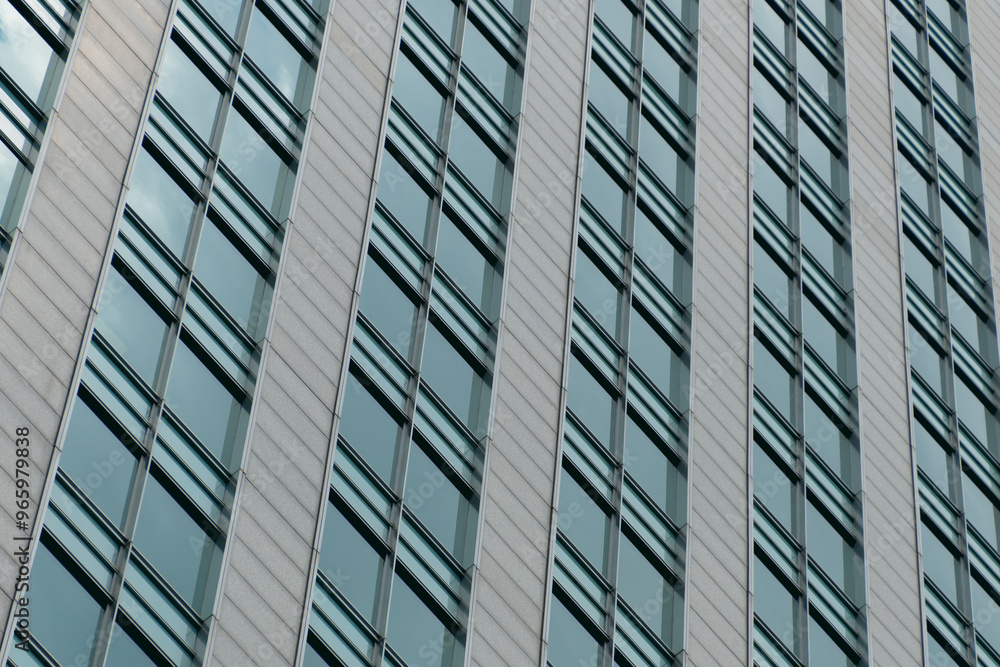 Multi-storey building in the city center. Business center, office. Modern architecture. Details of a modern building. Multi-storey building in the city center. Business center, office. Modern architecture. Details of a modern building.