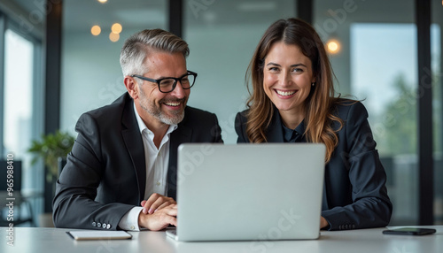 Two busy happy professional business man and woman executive leaders team using laptop working on computer at work desk having conversation on financial project at meeting in office. 