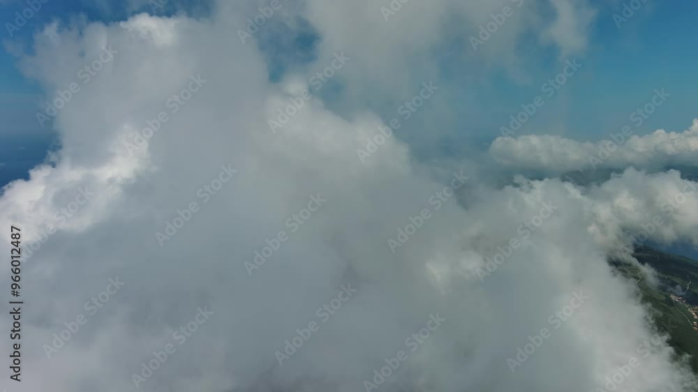 Flying through beautiful white fluffy clouds in blue sky. Airplane travel background, 4k Flying through beautiful white fluffy clouds in blue sky. Airplane travel background, 4k