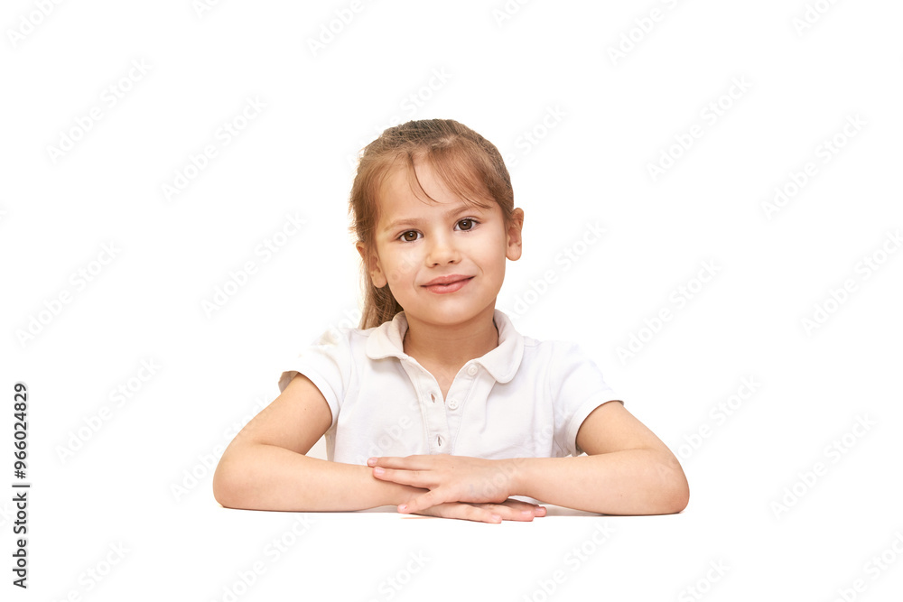Smiling young girl in white polo shirt at neutral background - portrait for education, family projects Smiling young girl in white polo shirt at neutral background - portrait for education, family projects