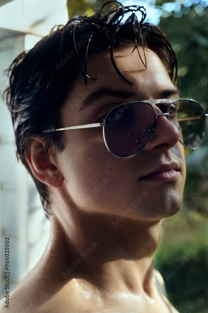 portrait of a handsome man with glasses and well-groomed hair portrait of a handsome man with glasses and well-groomed hair