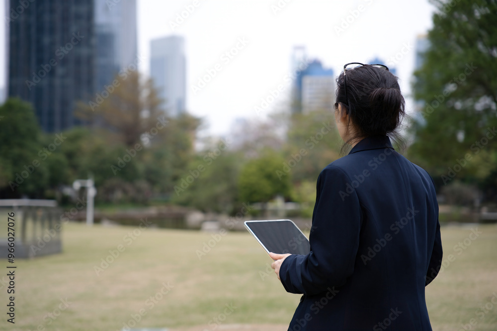 Fototapeta premium Business Professional Enjoying Work in a Serene Urban Park